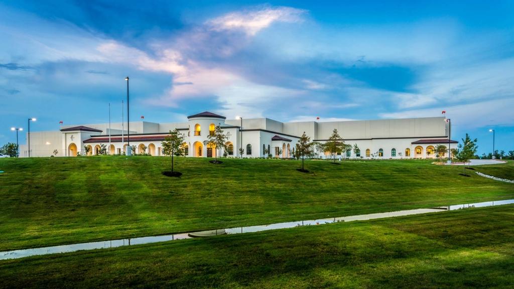 Facility exterior at dusk.